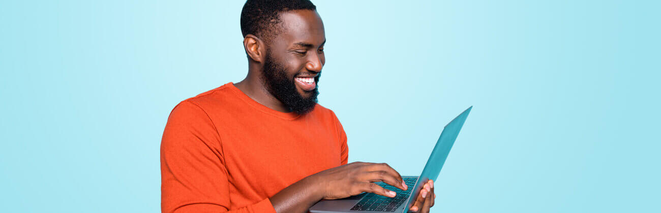 African American man secures his laptop from online threats