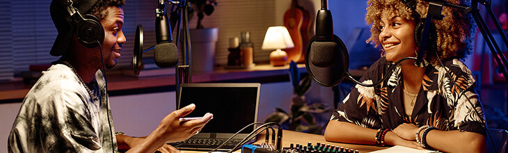 Two young people livestream with gig speed in a well-equipped home studio