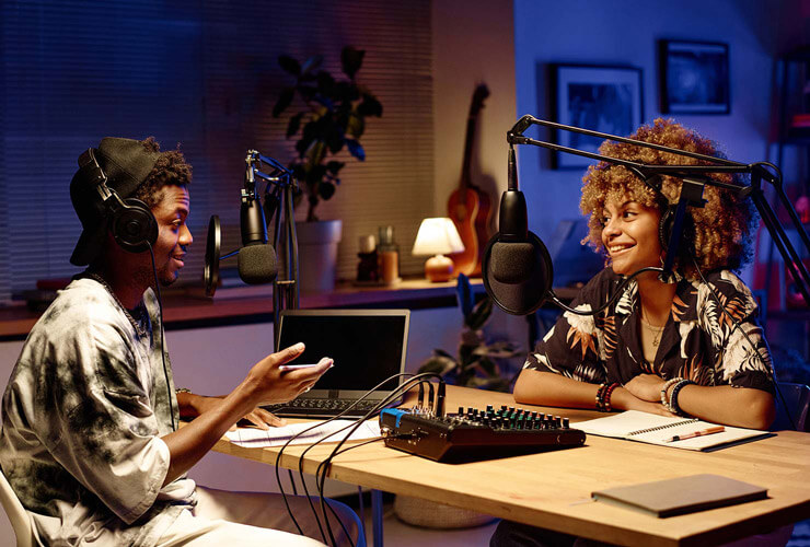 Two young people livestream with gig speed in a well-equipped home studio